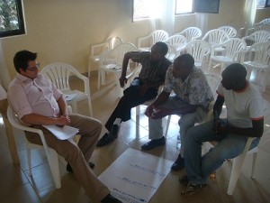 Will Goodhand leads a breakout session with members of the Dukundane Family