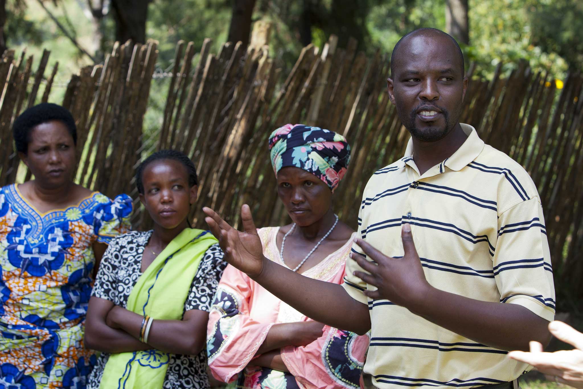 Samuel Munderere, Chief Executive of Survivors Fund, with women survivors of the genocide who have children born of rape