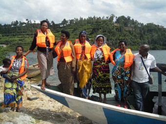 Women Survivors in Karongi receiving a boat (to set up a ferry business) through the Good Gifts project