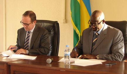 The International Organisation for Migration (IOM) and the Minister of Justice of Rwanda signing an MOU on a study into potential mechanisms for international reparation for survivors of the genocide in Rwanda