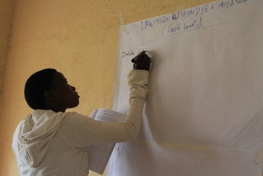 A trainee in Ruhnago, in the Southern Province, practices calculating profit and loss. 