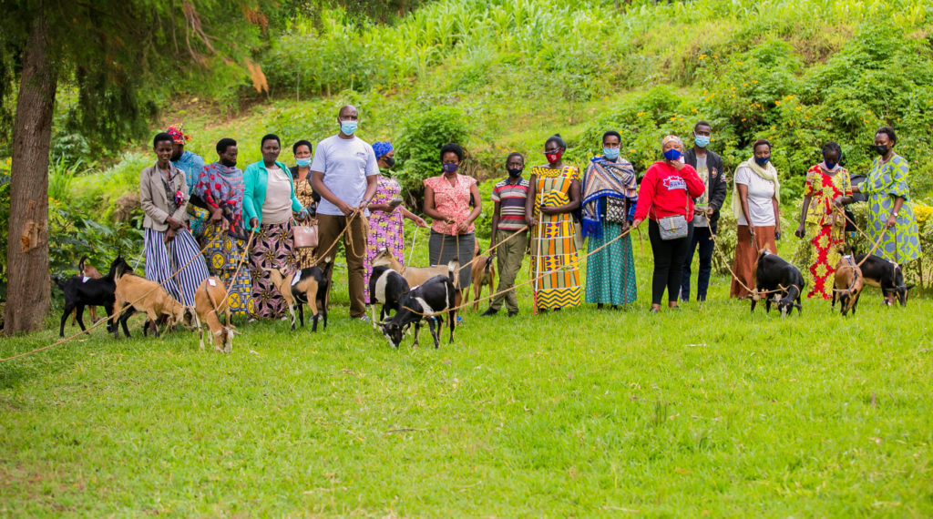 Samuel Munderere, CEO of Survivors Fund (SURF), with recipients of goats from Good Gifts
