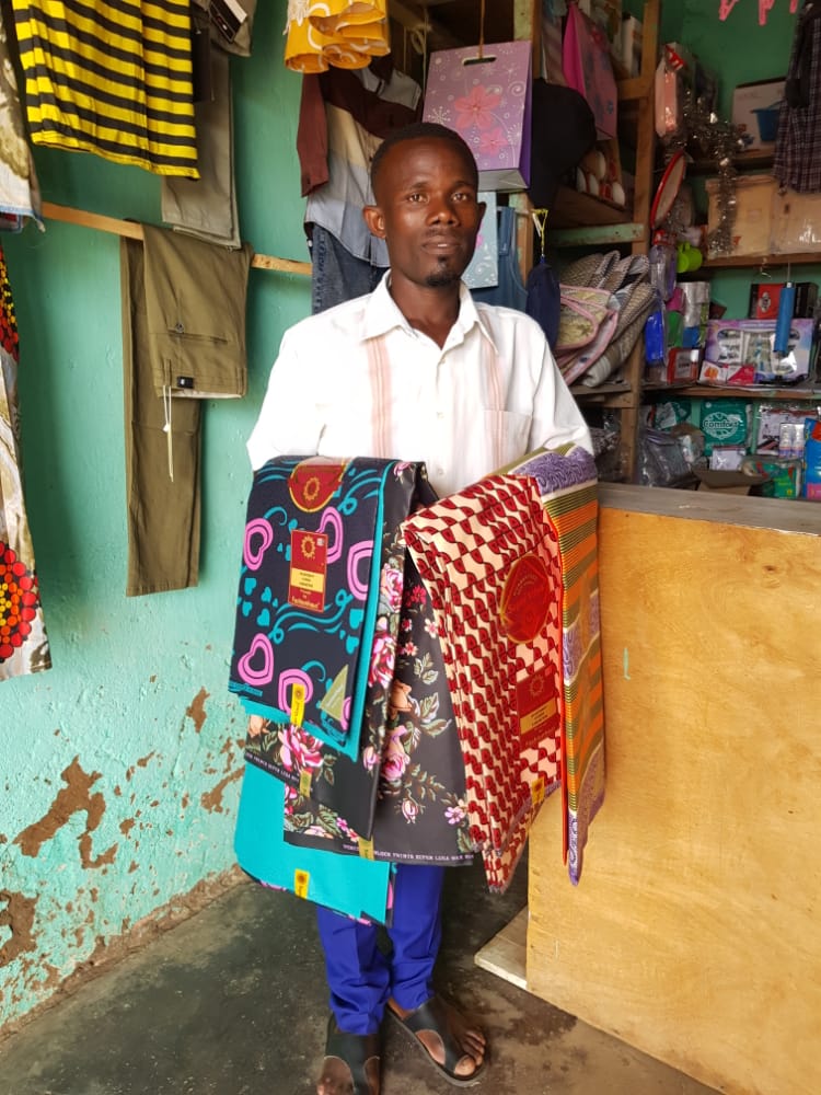 Byukusenge at his business made possible by the EVKEP project
