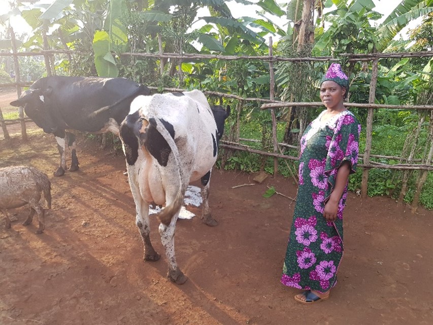 Patricia with her cow, donated through the Good Gifts Catalogue