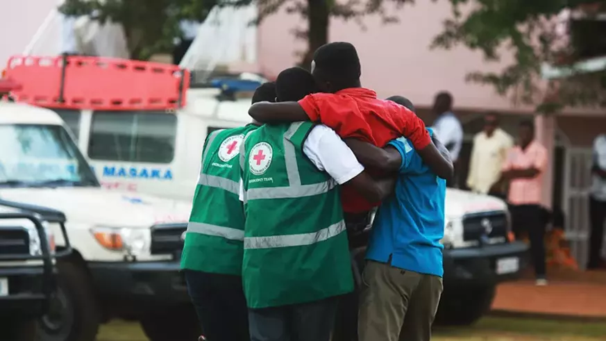Red Cross volunteers help a trauma victim at Kicukiro Nyanza Genocide Memorial on May 4, 2019 . / Photo by Sam Ngendahimana