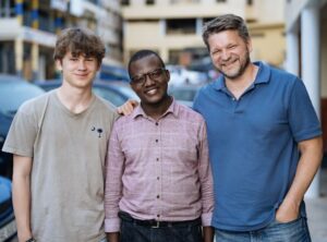 Second-generation survivor and tech entrepreneur Paulin Nkusi with KYBORA CEO Alan Vanderborght and his son Lucas Vanderborght. (Photo Credit: Serrah Galos)